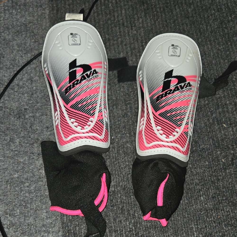 Vibrant Pink and Black Sports Shin Guards for Performance